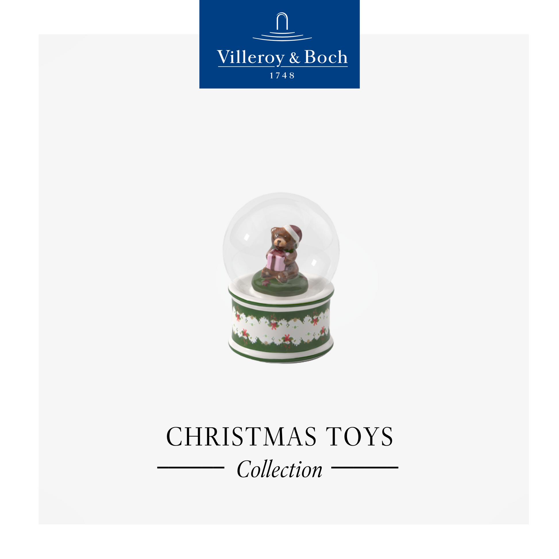 Villeroy & Boch Christmas toy collection with a snow globe featuring a bear on a white background.