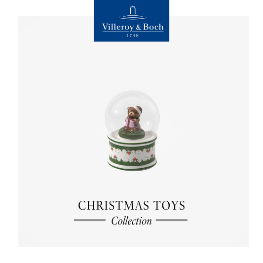 Villeroy & Boch Christmas toy collection with a snow globe featuring a bear on a white background.