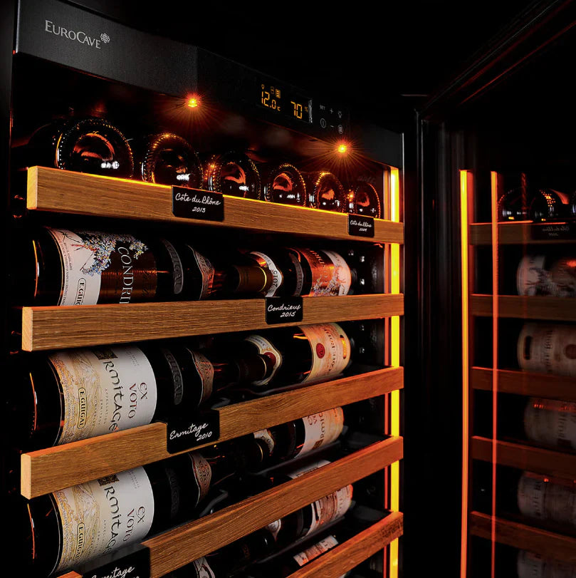 EuroCave Revelation wine cabinet — amber-lit bottles